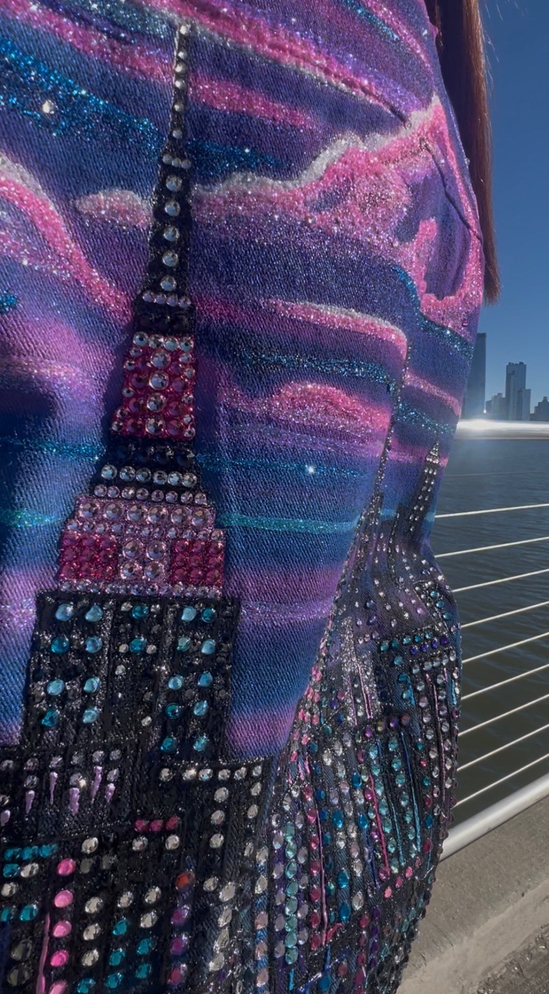 Close-up of a colorful, textured fabric with cityscape Loria NYC Art design.
