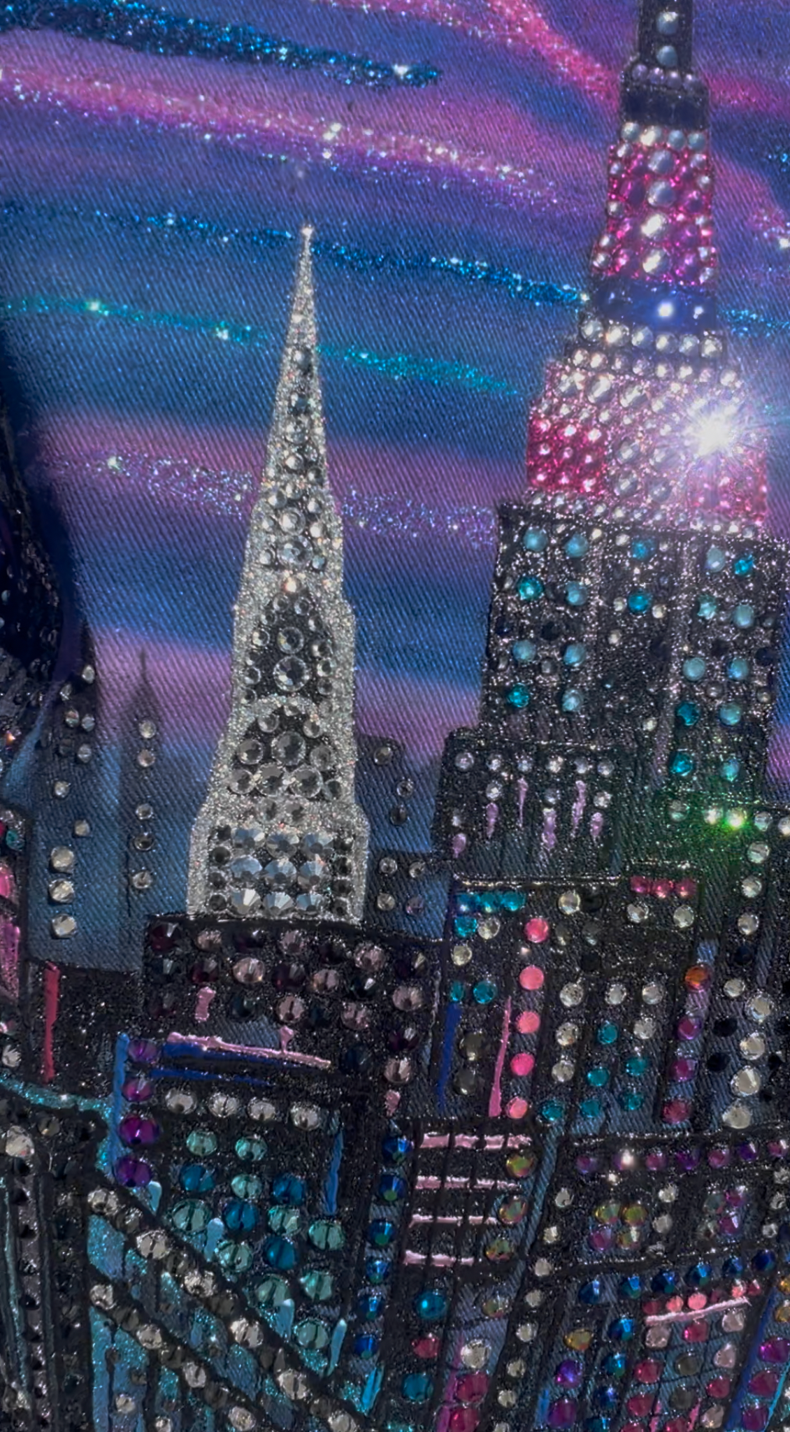 Decorative fabric with a cityscape Loria NYC Art design featuring tall buildings and a starry night sky.