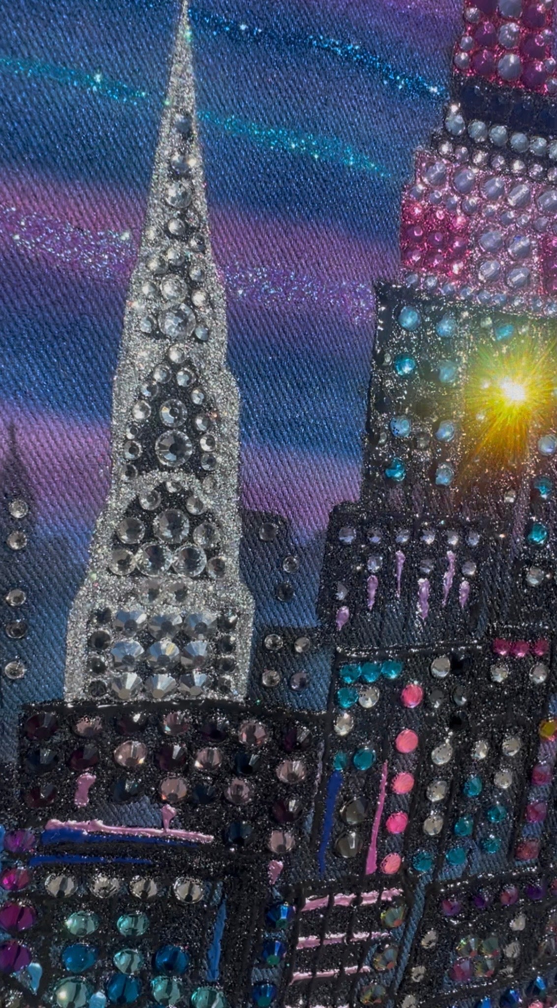 Decorative fabric with a cityscape Loria NYC Art design featuring tall buildings and a starry night sky.