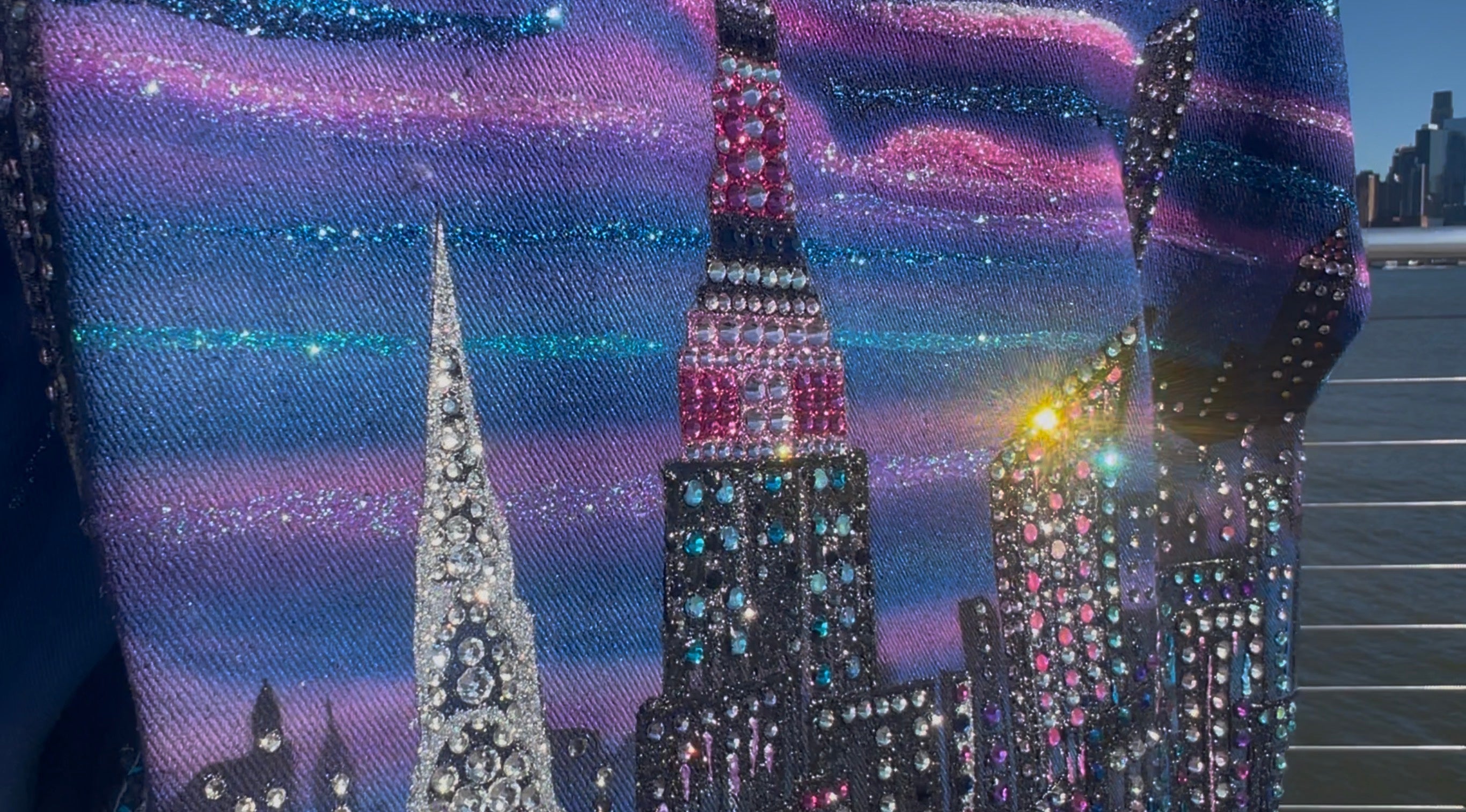 Jacket with a cityscape Loria NYC Art design featuring tall buildings and a starry night sky.
