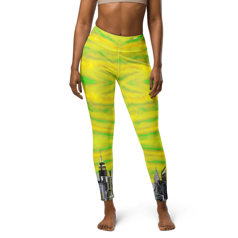 Yellow and green Loria NYC Art leggings with cityscape design on a white background