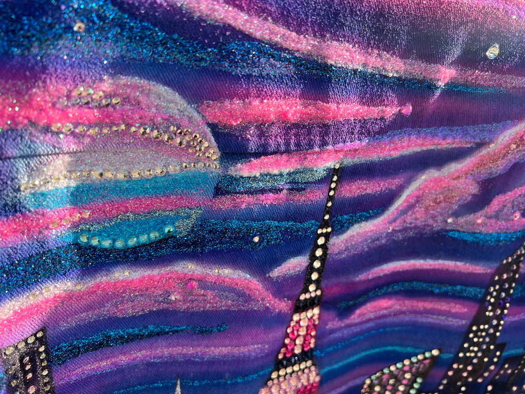 Close up  detailed blue and pink Loria NYC Art jacket with a city skyline  