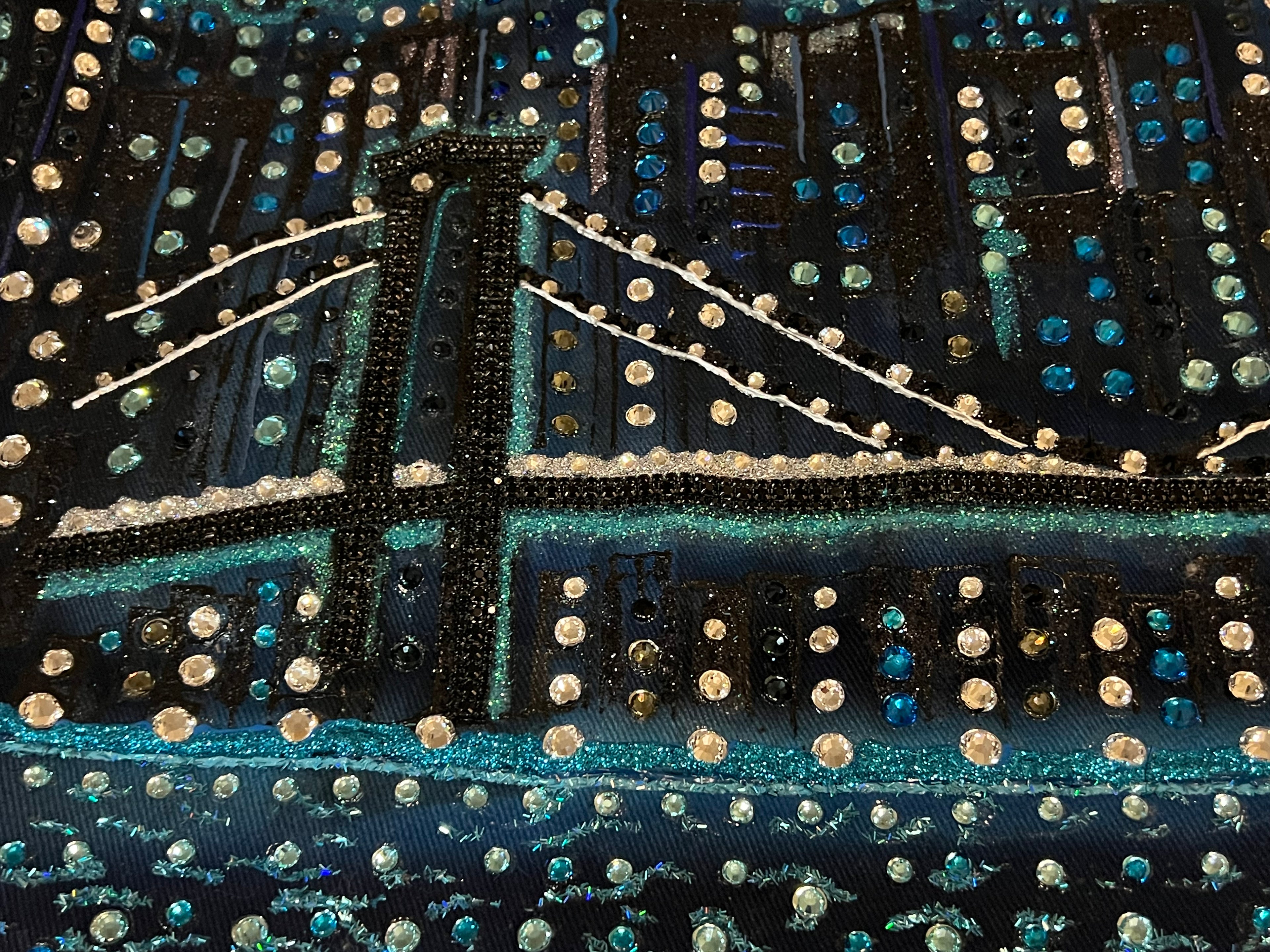 Decorative fabric with a cityscape Loria NYC Art design featuring lights and a bridge.