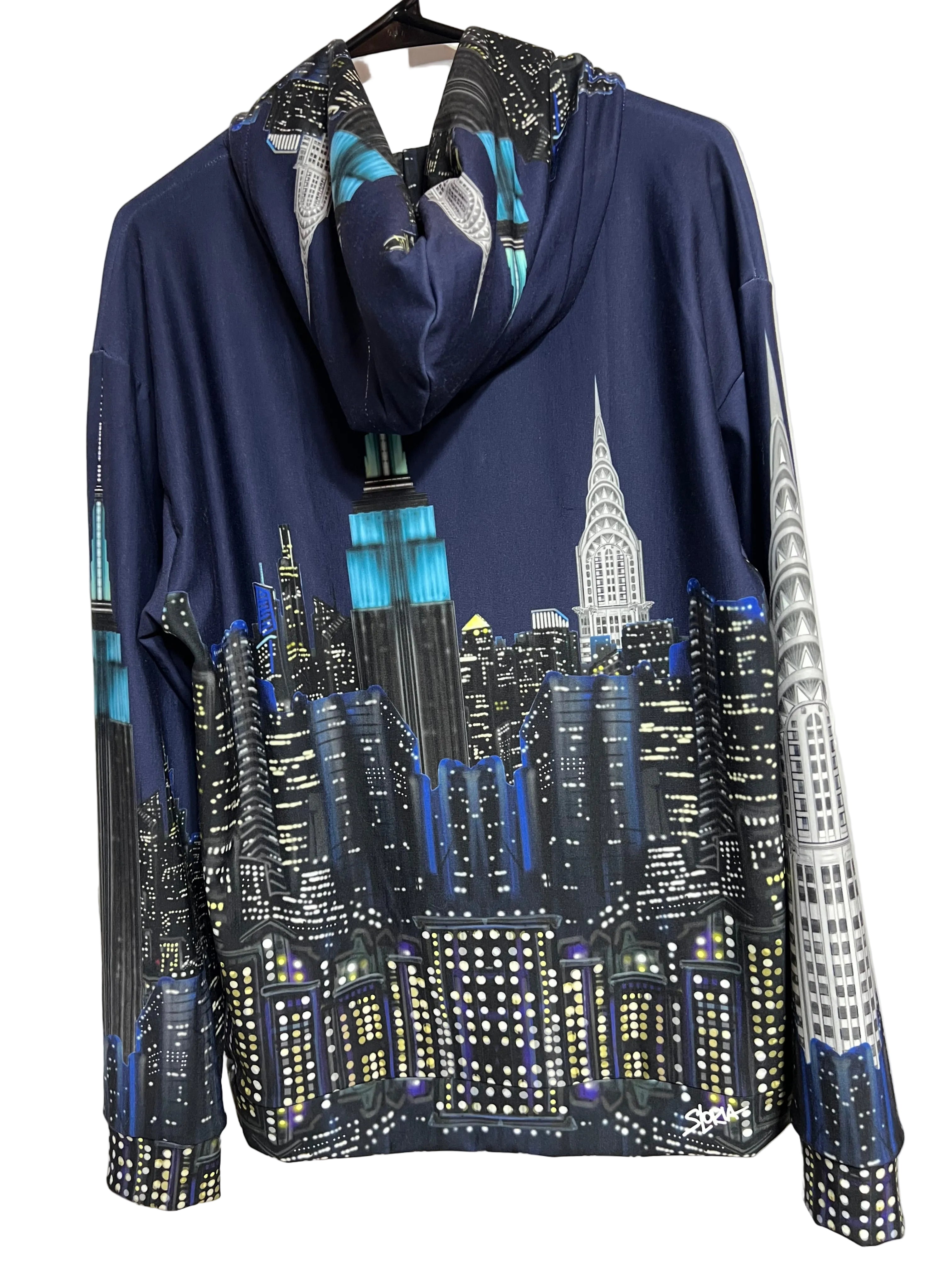 Folded navy blue fabric with cityscape Loria NYC Art on a white background