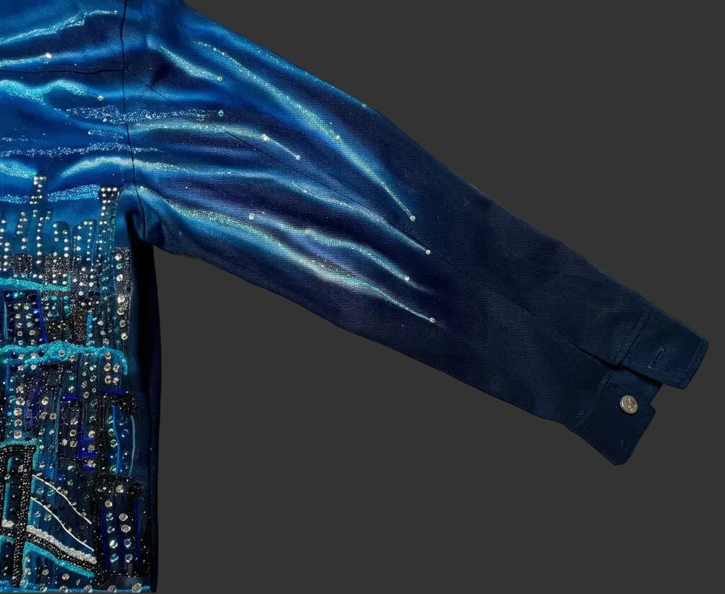 Blue sequined Loria NYC Art garment on a white fabric background
