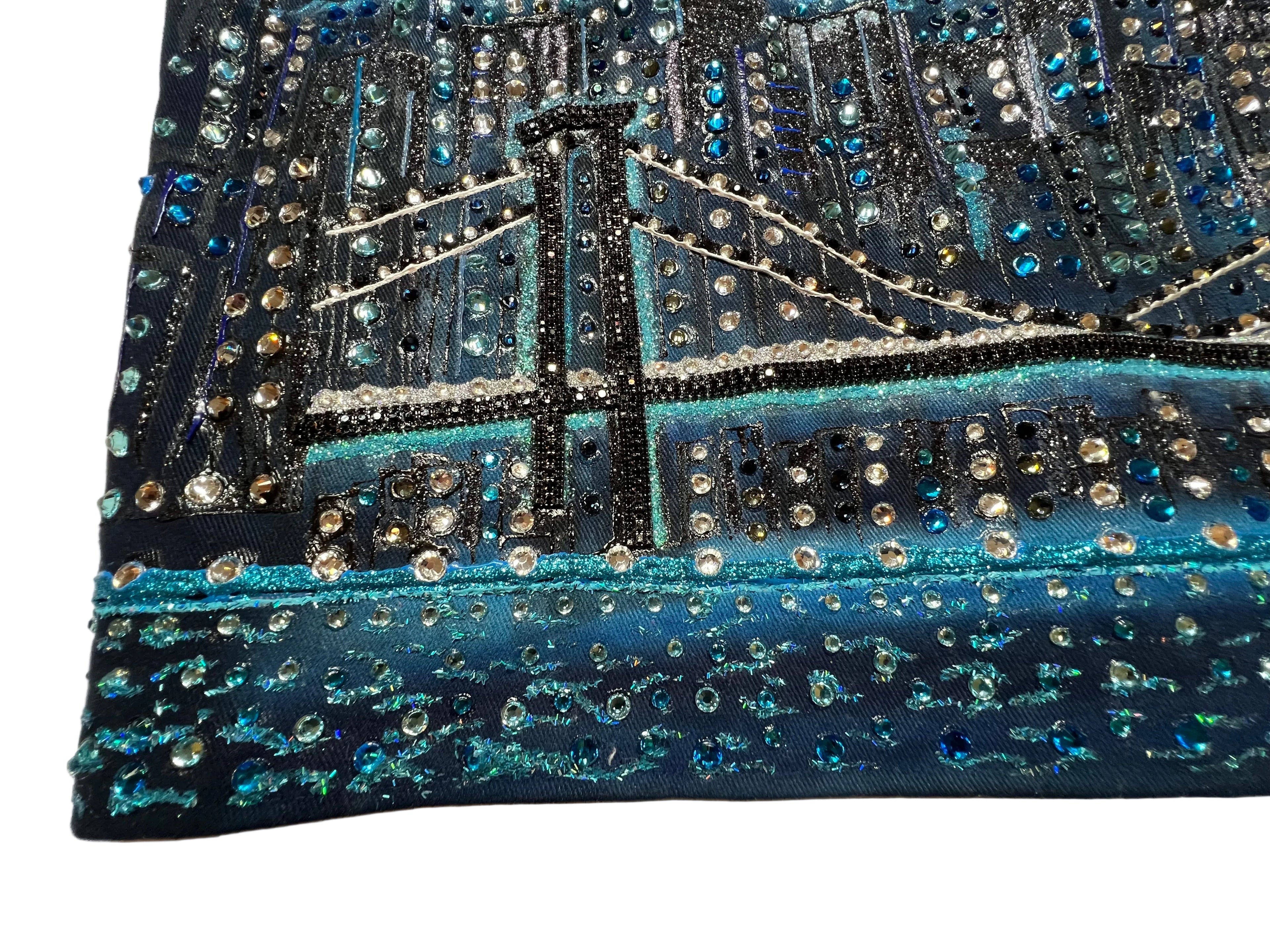 Decorative item with blue and black pattern on a white surface