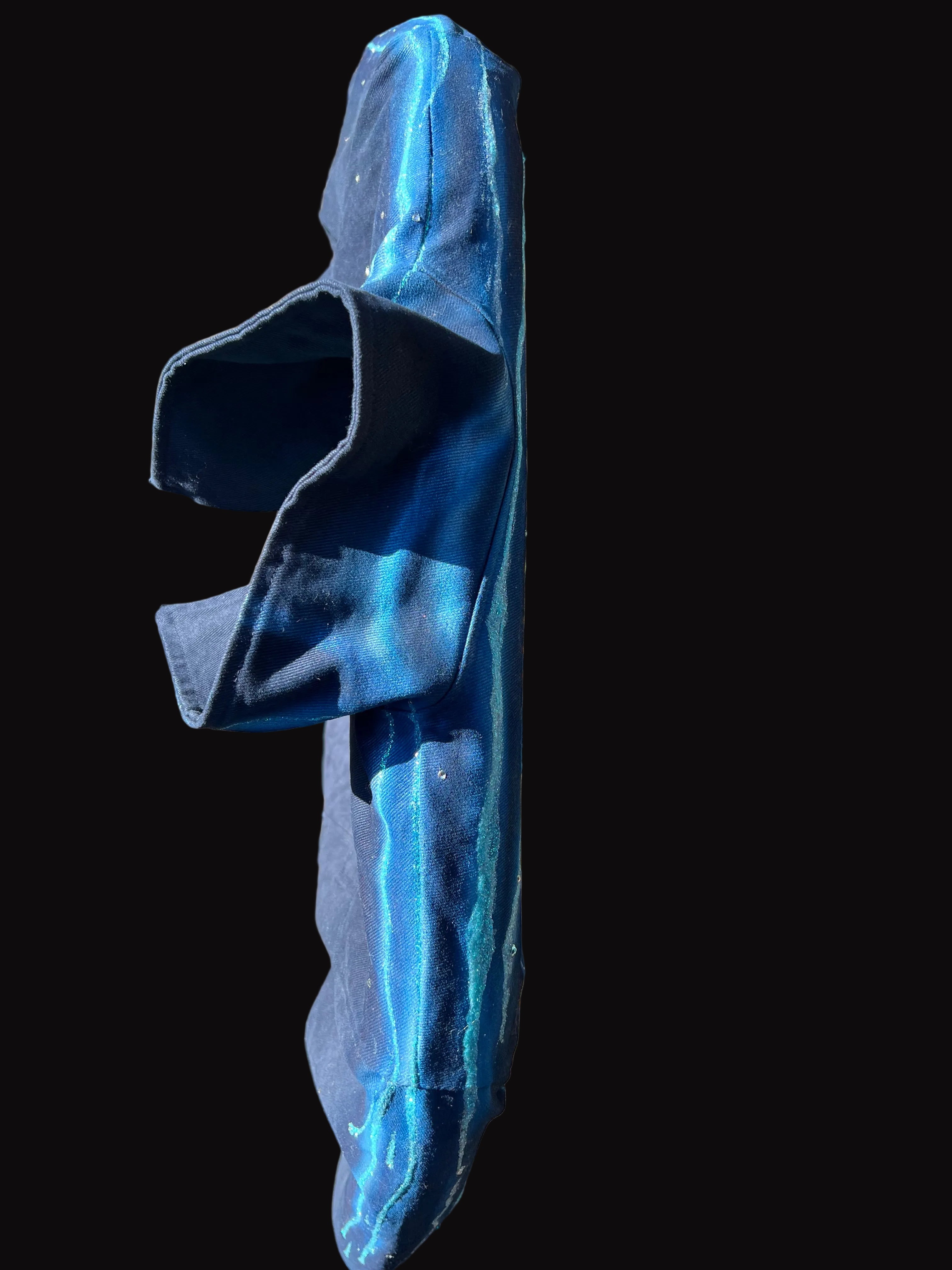 Blue Loria NYC Art garment on a black surface