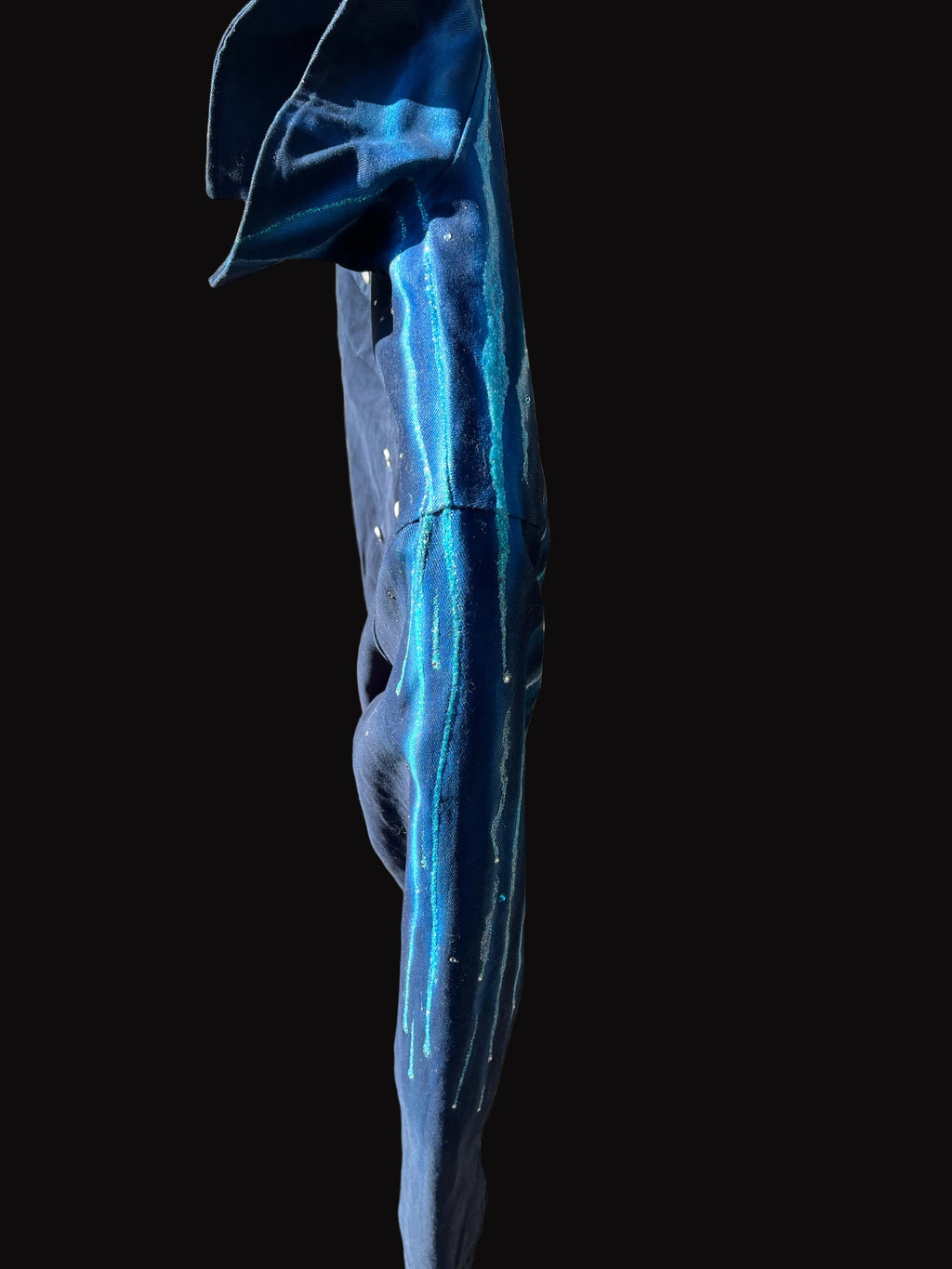 Top view of Blue jacket with Loria NYC Art with a black background