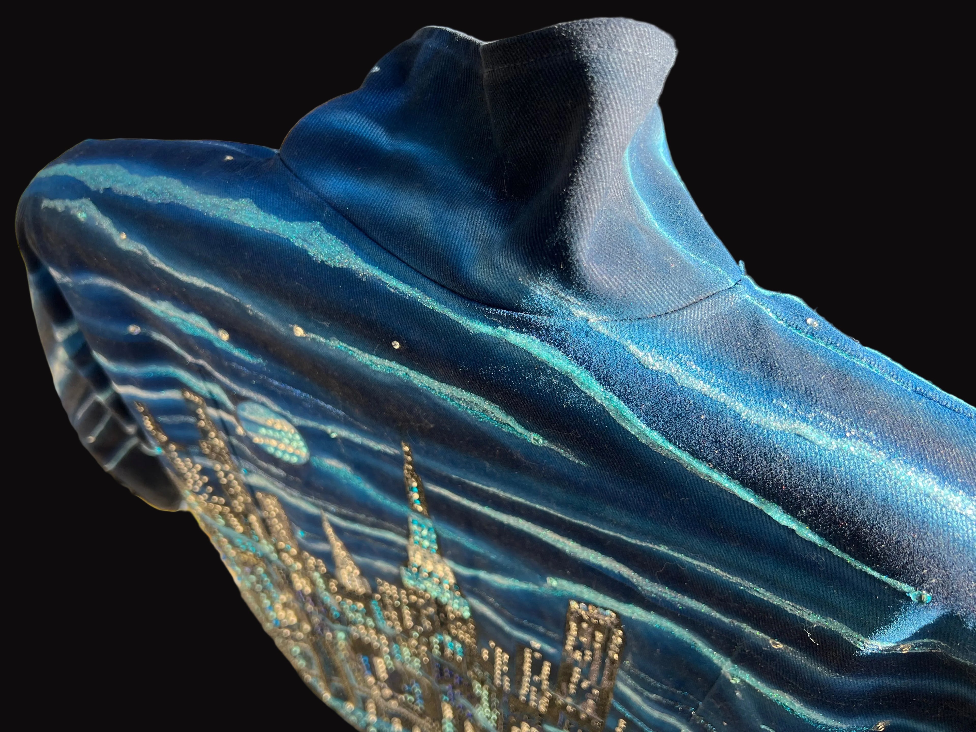 Blue jacket with a cityscape Loria NYC Art design on a textured surface