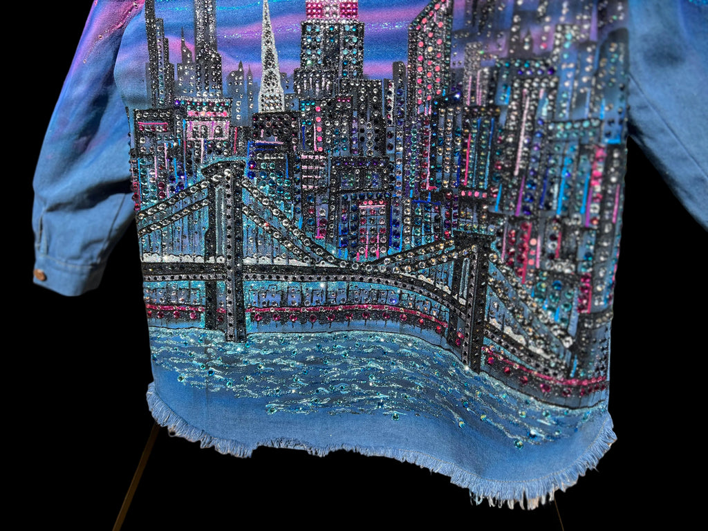 Denim jacket with a cityscape Loria NYC Art design featuring a bridge and skyline.
