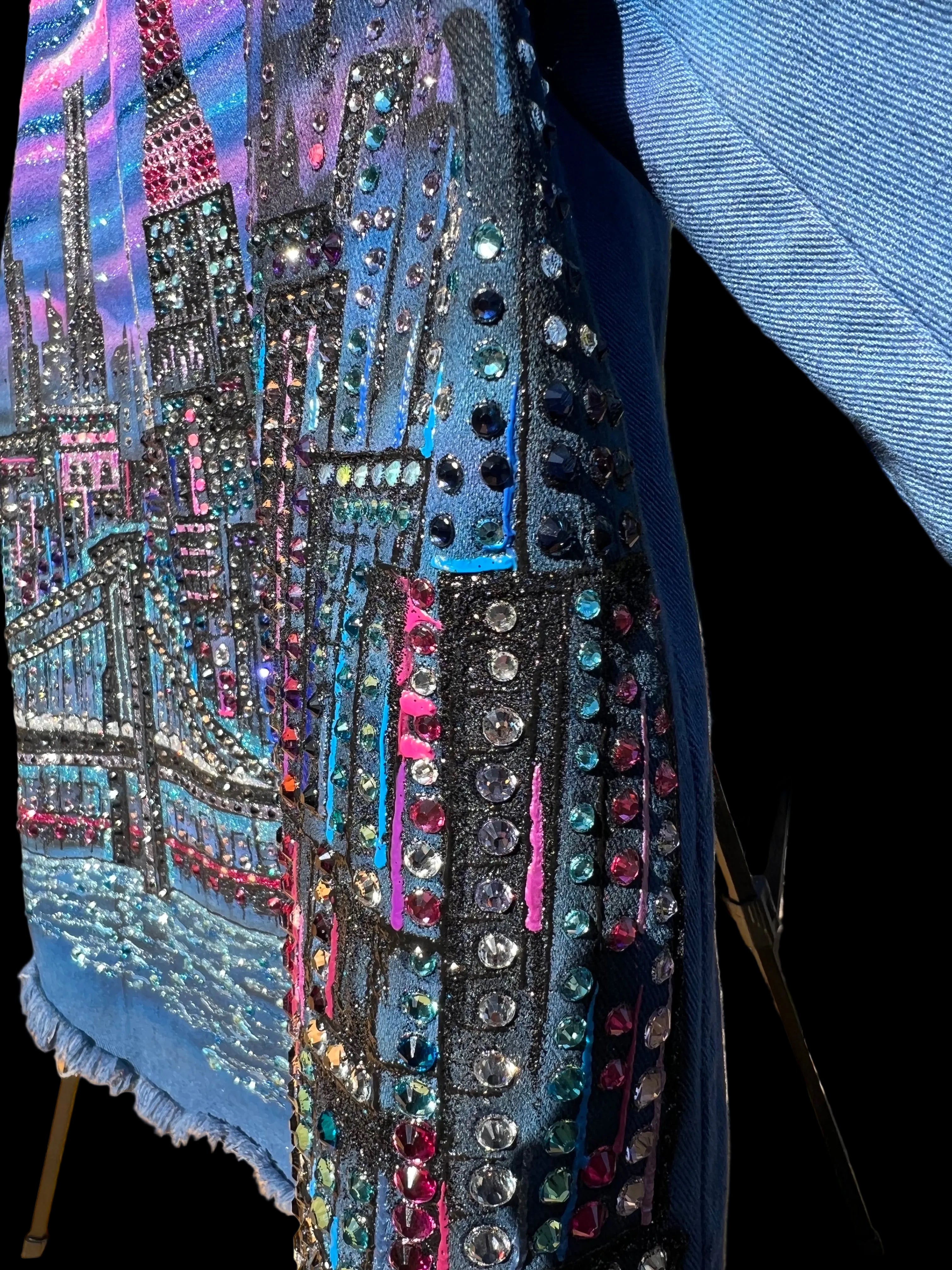 Colorful sequined fabric with a Loria NYC Art on a blank background 