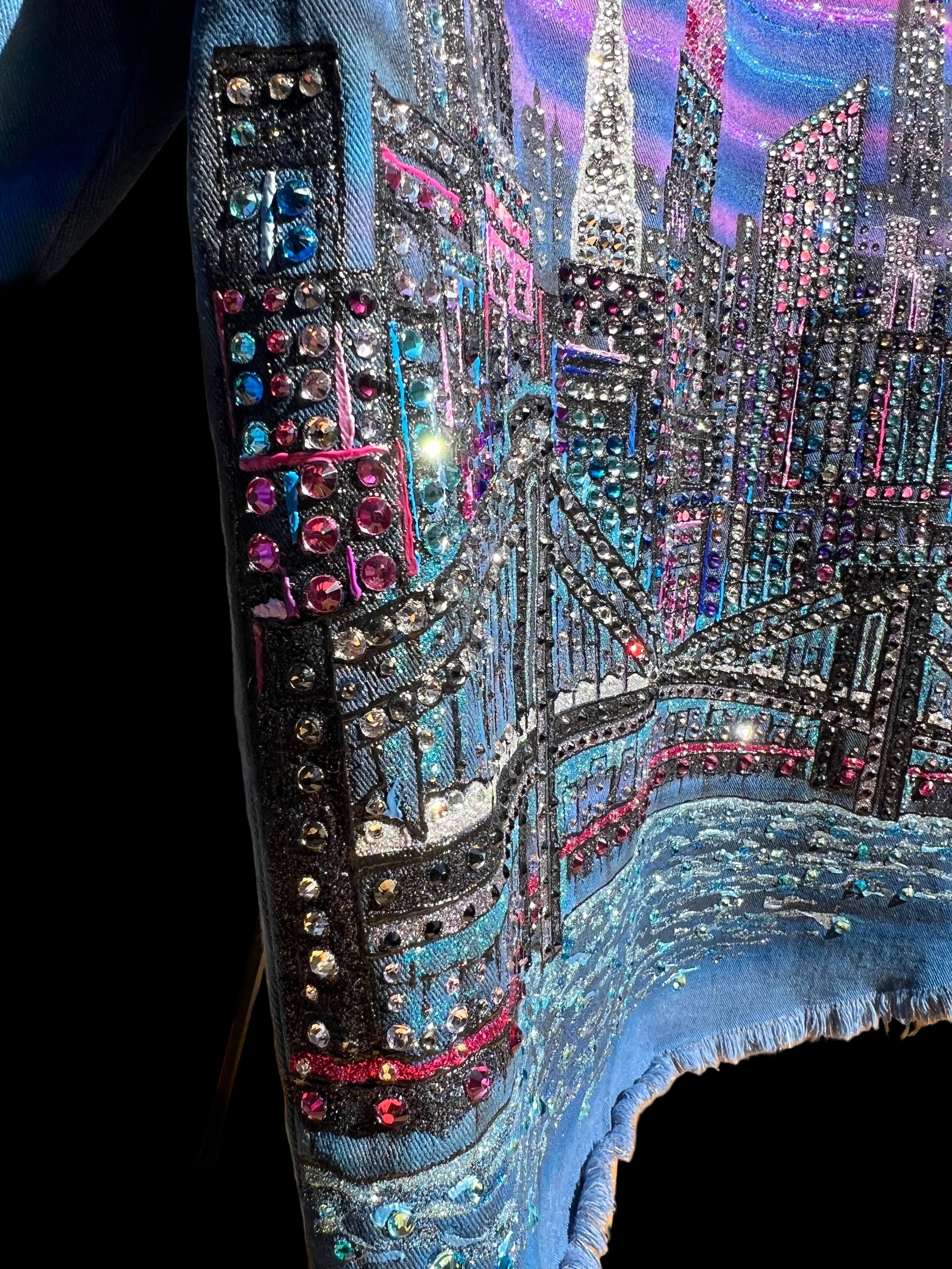 Colorful Loria NYC Art embellishments on a jacket with a scenic background