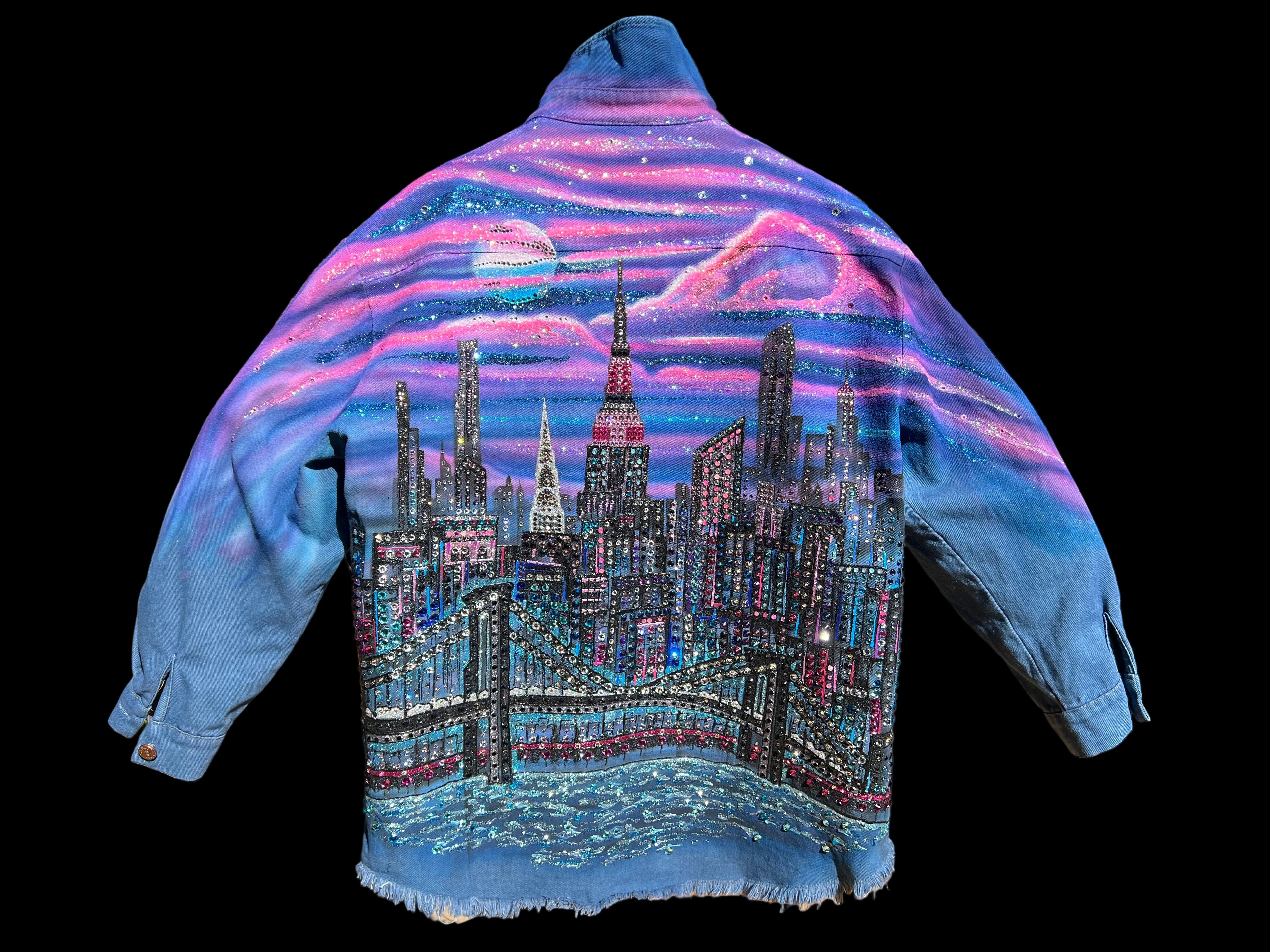 Denim jacket with a colorful Loria NYC Art cityscape design on a black background 