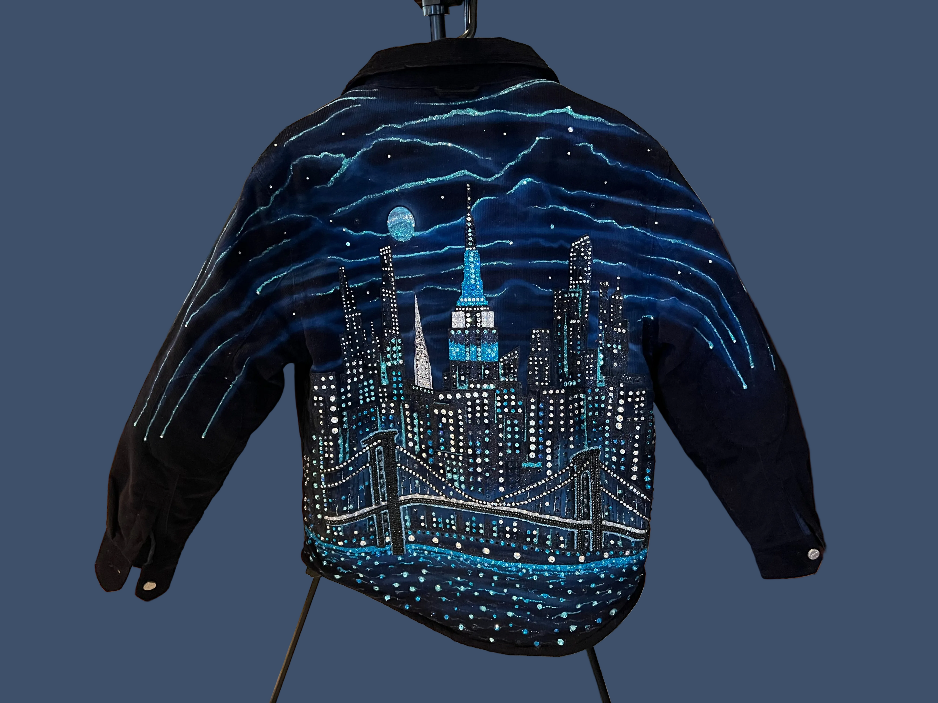 Jacket with a cityscape Loria NYC Art design featuring the Empire State Building on a dark background