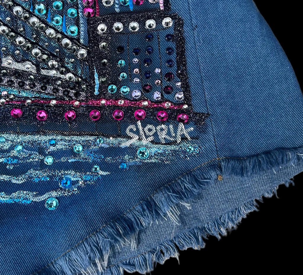 Blue fabric with decorative patterns and 'Sloria' branding on a fabric surface