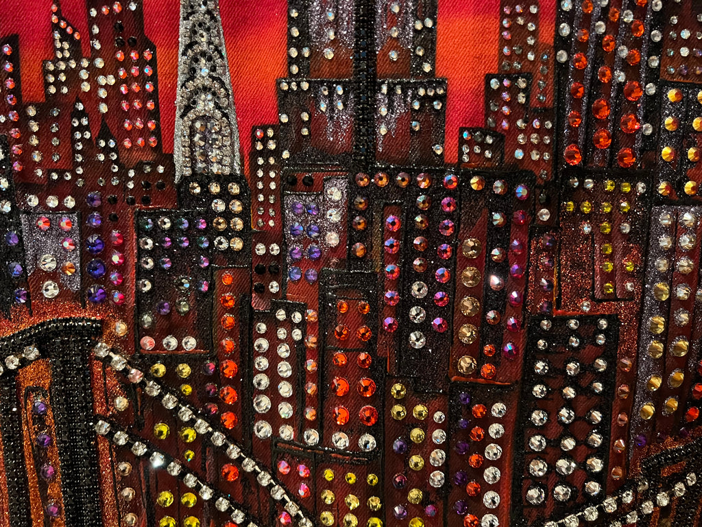 Artistic Loria NYC Art depiction of a cityscape with colorful embellishments on a dark background