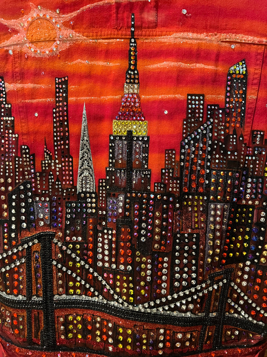 Decorative fabric Loria NYC Art with beadwork and embroidery on a red background