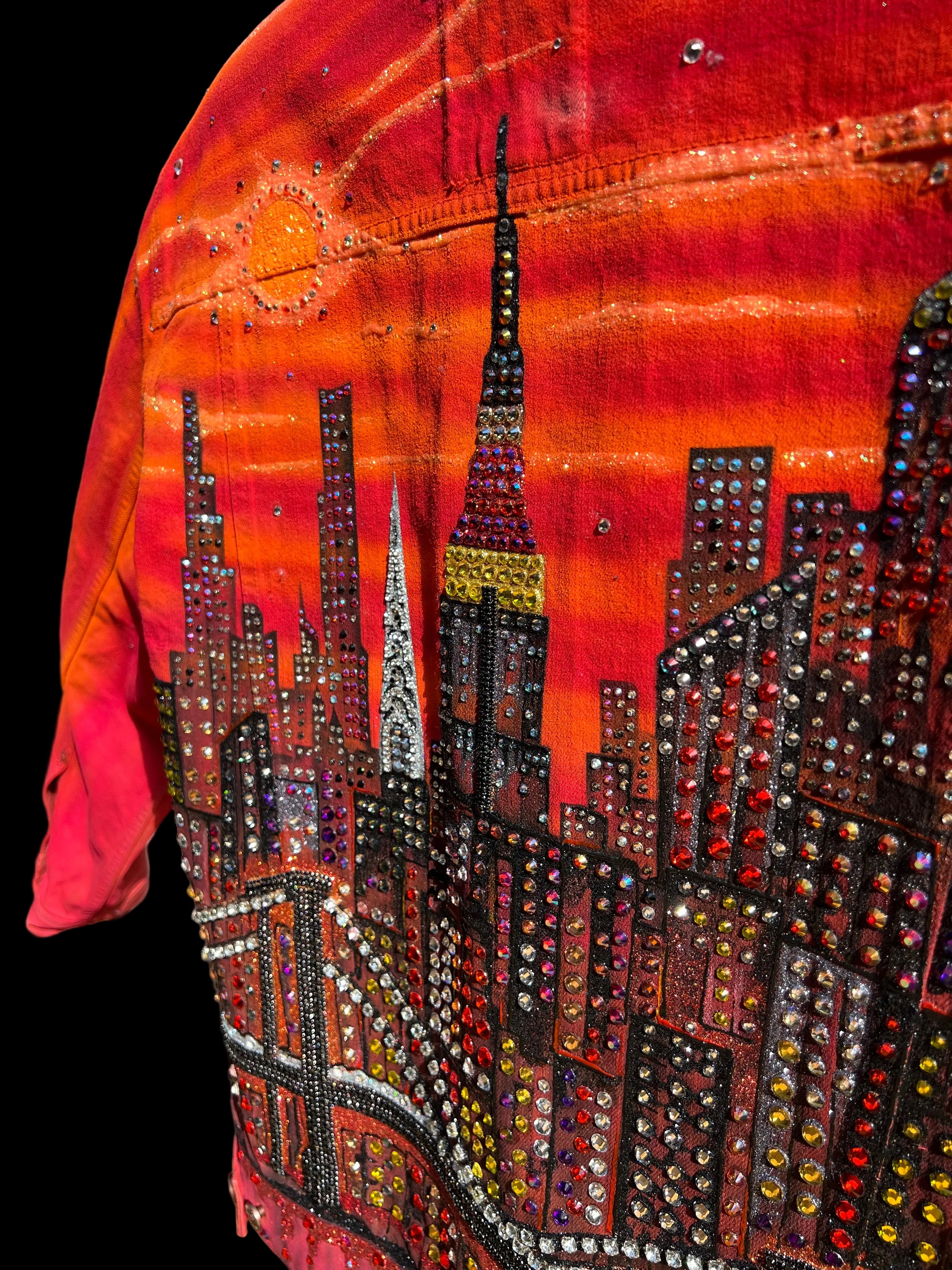 Close-up of a  Loria NYC Art with colorful beadwork on a black background