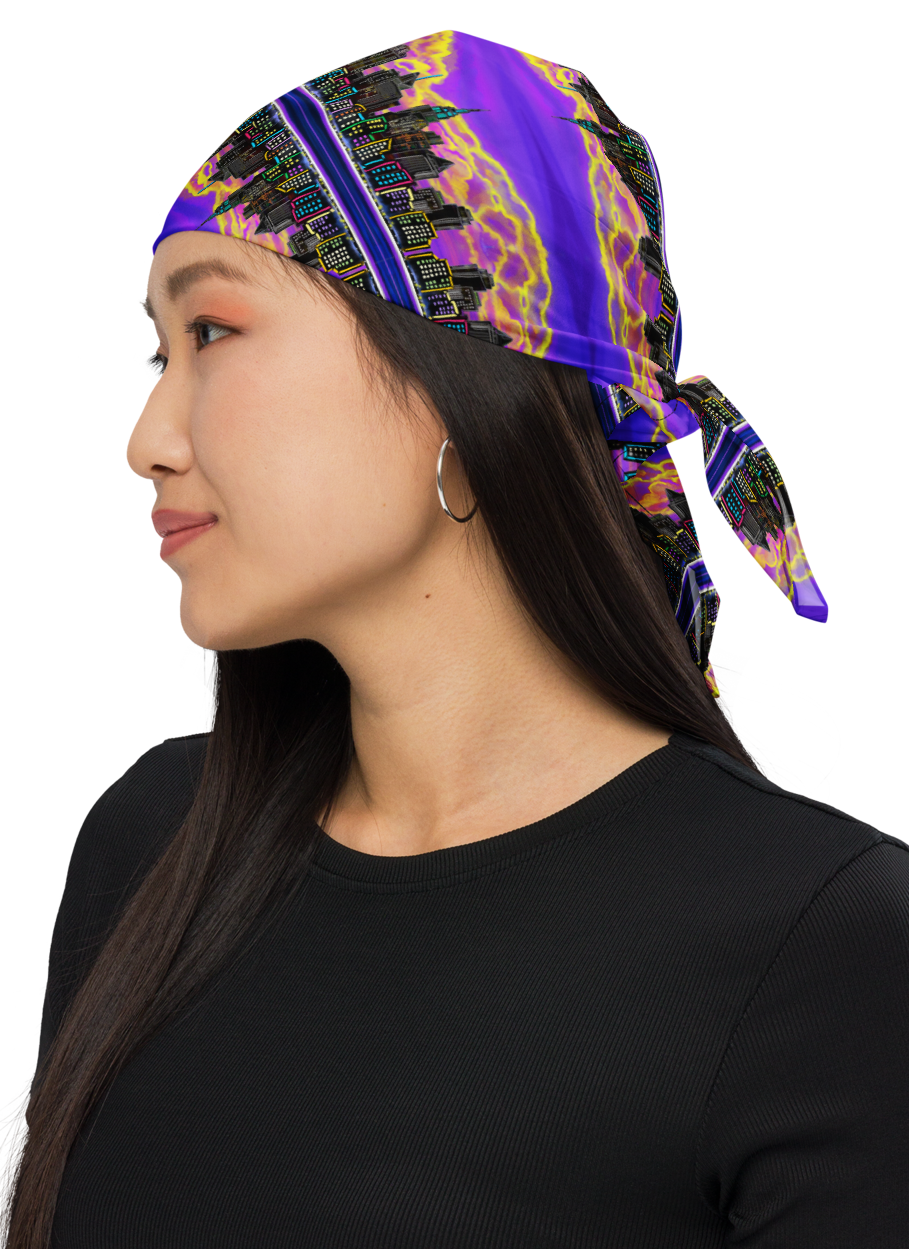 Woman wearing a colorful Loria NYC Art headscarf on a white background