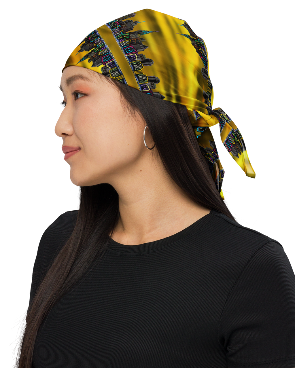 Woman wearing a yellow and black patterned Loria NYC Art headscarf on a white background