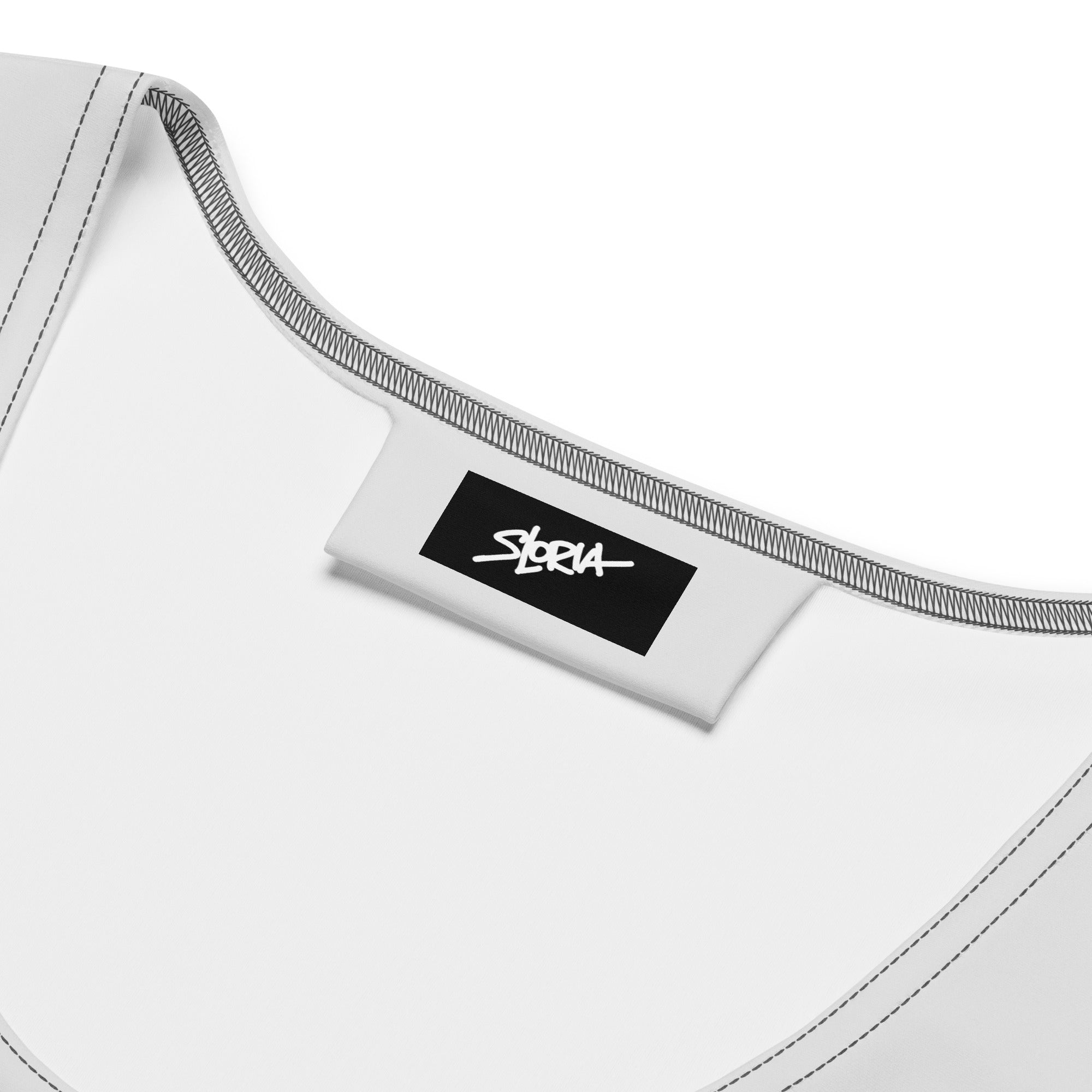 Close-up of a white garment with a black label featuring the designer brand 'S.Loria' on a white background.
