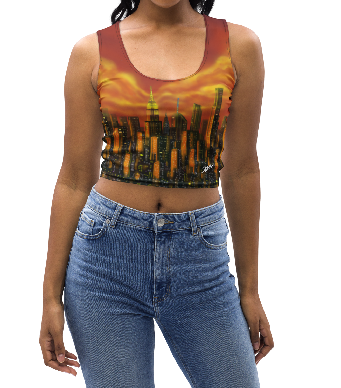 Woman wearing a colorful Loria NYC Art tank top and blue jeans on a white background