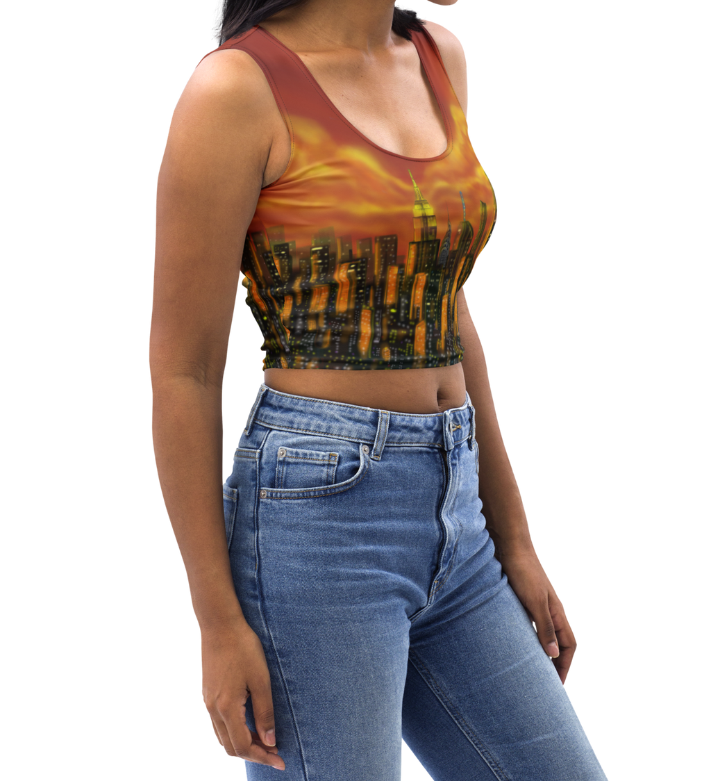 Woman wearing a colorful Loria NYC Art tank top and blue jeans on a white background