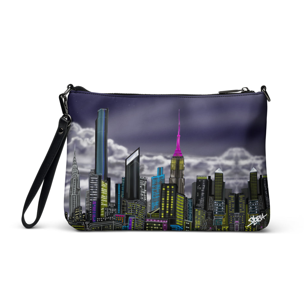 Crossbody bag with Loria NYC Art cityscape design on a white background