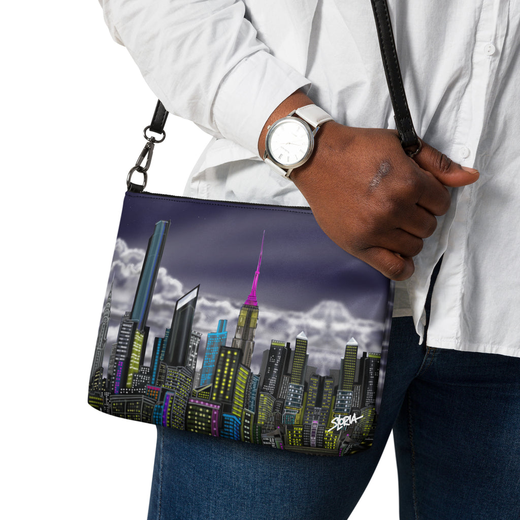 Person holding a bag with a cityscape design