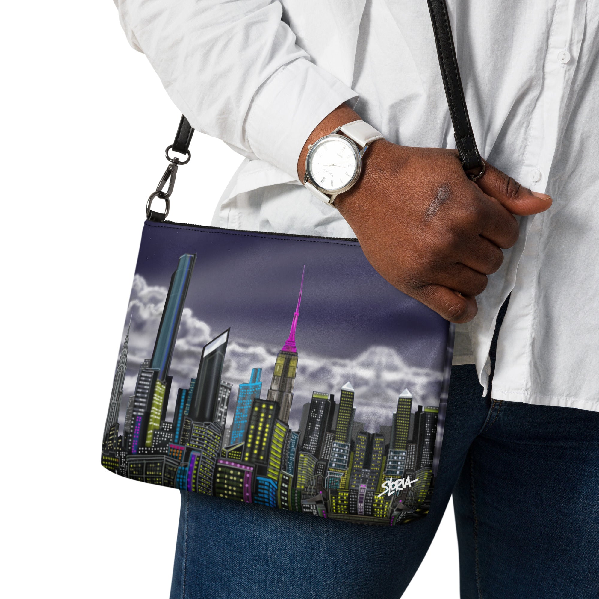 Person holding a bag with a cityscape design