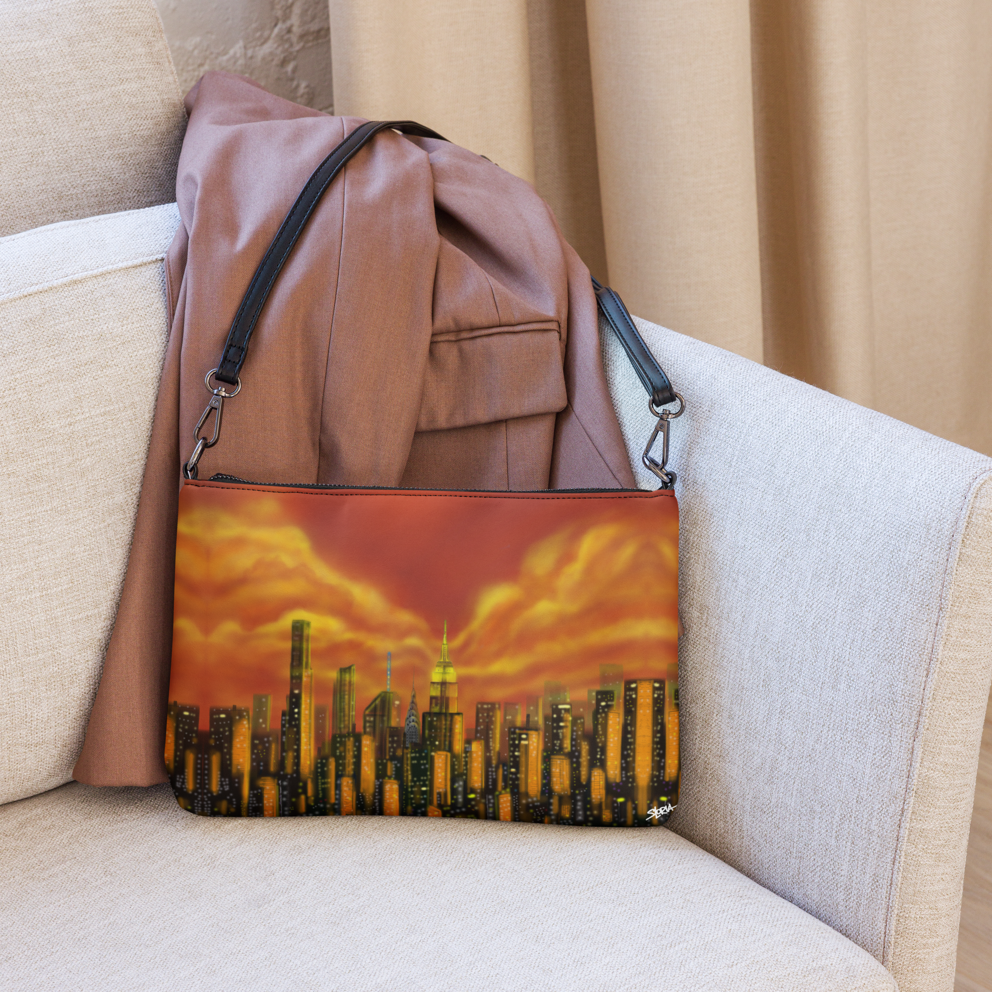 Brown backpack with a cityscape Loria NYC Art design on a beige couch