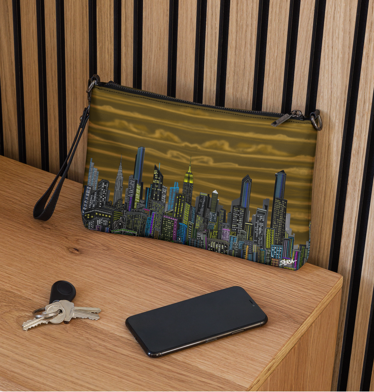 Cityscape Loria NYC Art bag on a wooden surface with keys and phone