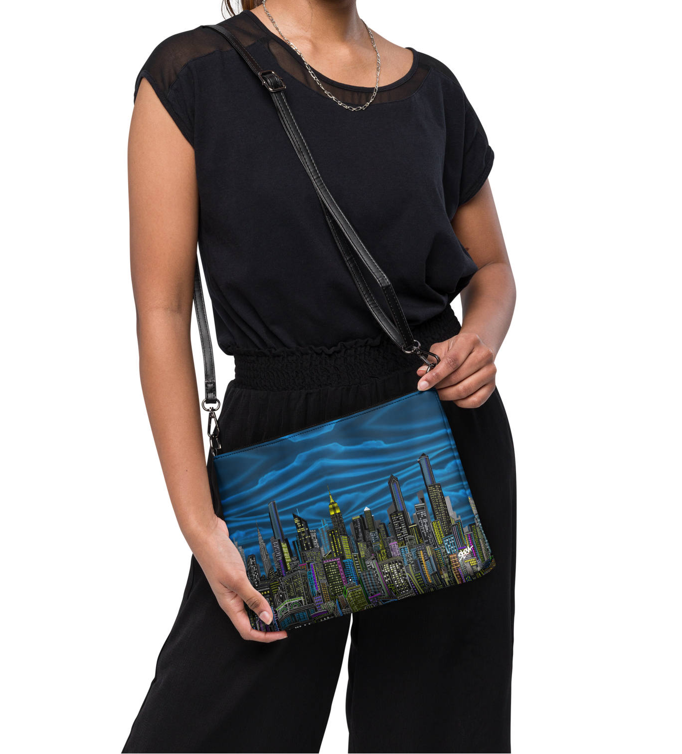 Woman holding a Loria NYC Art blue bag with a cityscape design on a white background