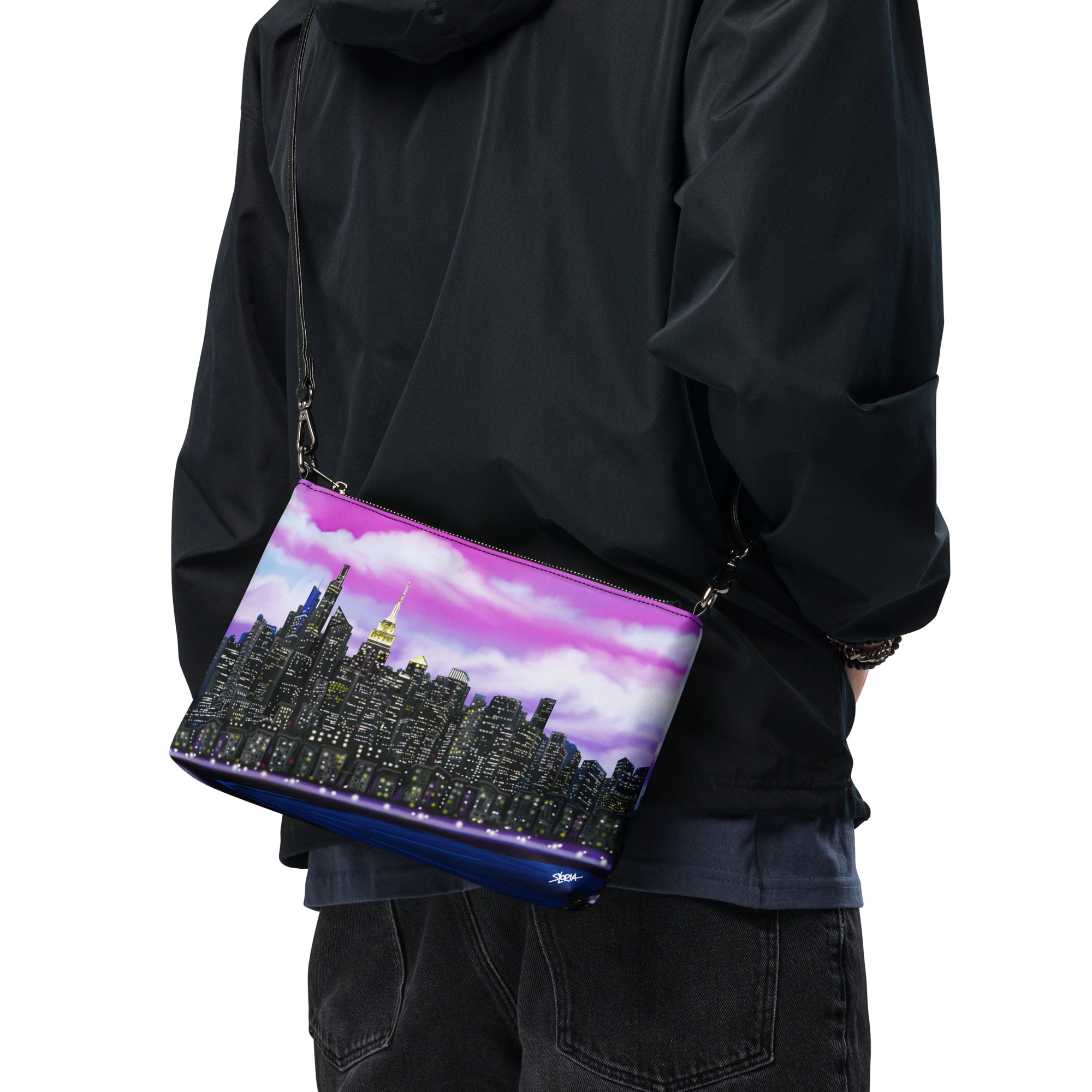 Man posing with Crossbody bag with a Loria NYC Art city skyline design 