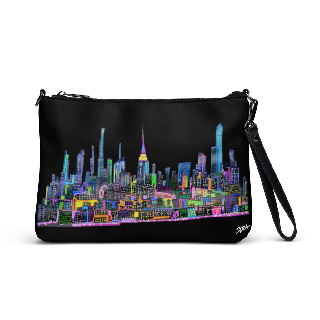 Black crossbody bag with colorful Loria NYC Art cityscape design on a white background