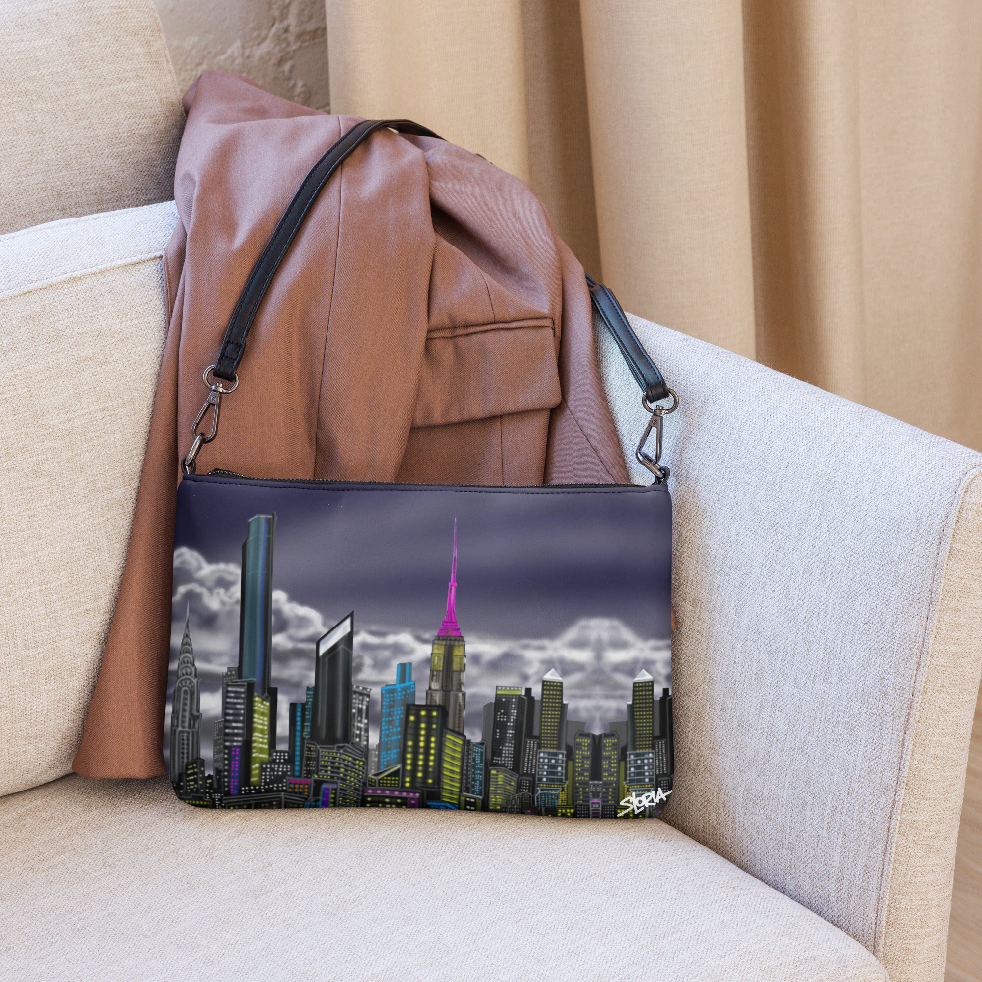 Cityscape bag with a leather jacket on a beige couch