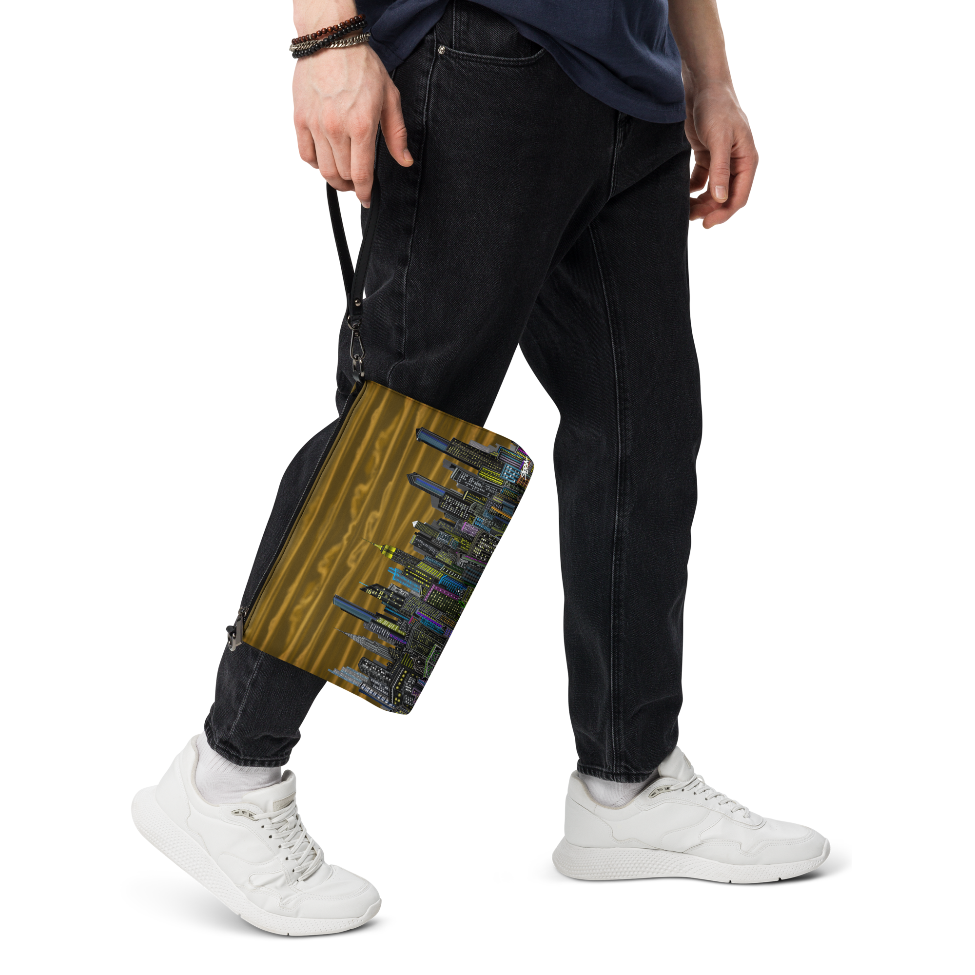 Person holding a bag with a Loria NYC Art colorful design, wearing black pants and white sneakers on a transparent background
