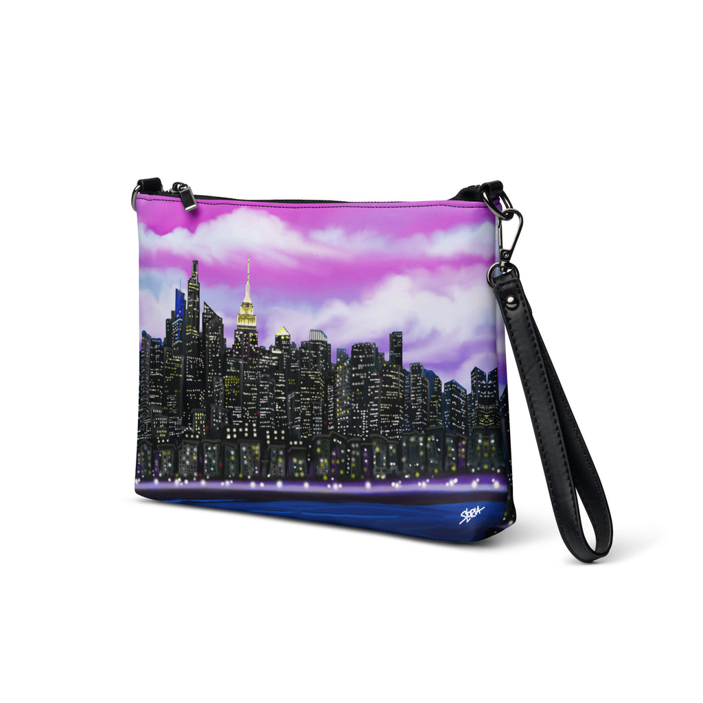 Crossbody bag with a Loria NYC Art city skyline design on a white background