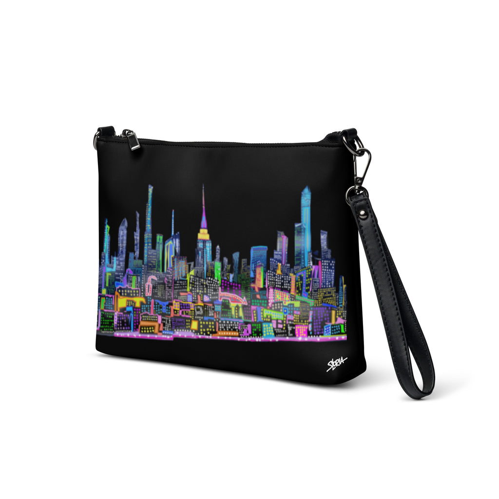 Black crossbody bag with colorful Loria NYC Art cityscape design on a white background