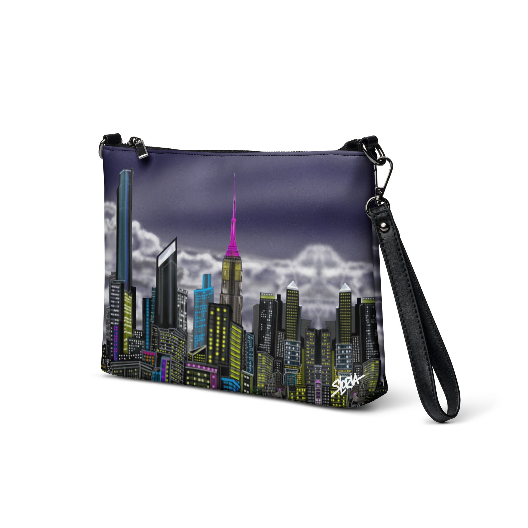 Crossbody bag with Loria NYC Art cityscape design on a white background