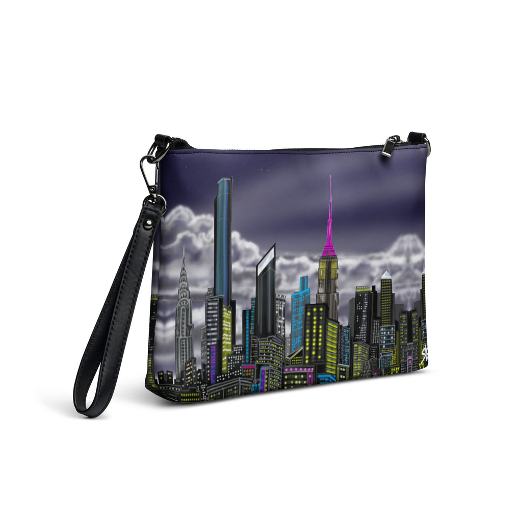 Crossbody bag with Loria NYC Art cityscape design on a white background