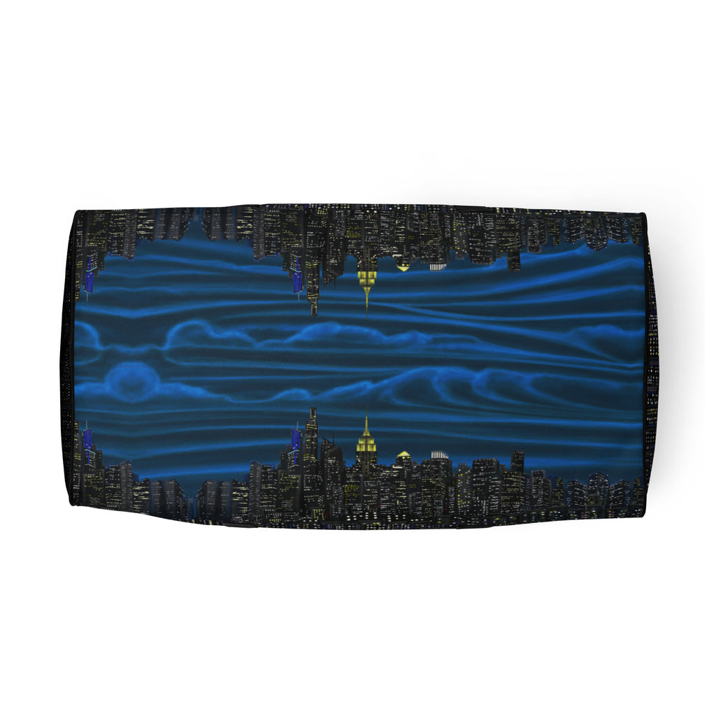 Folded fabric with a cityscape design featuring buildings and blue wavy patterns on a white background