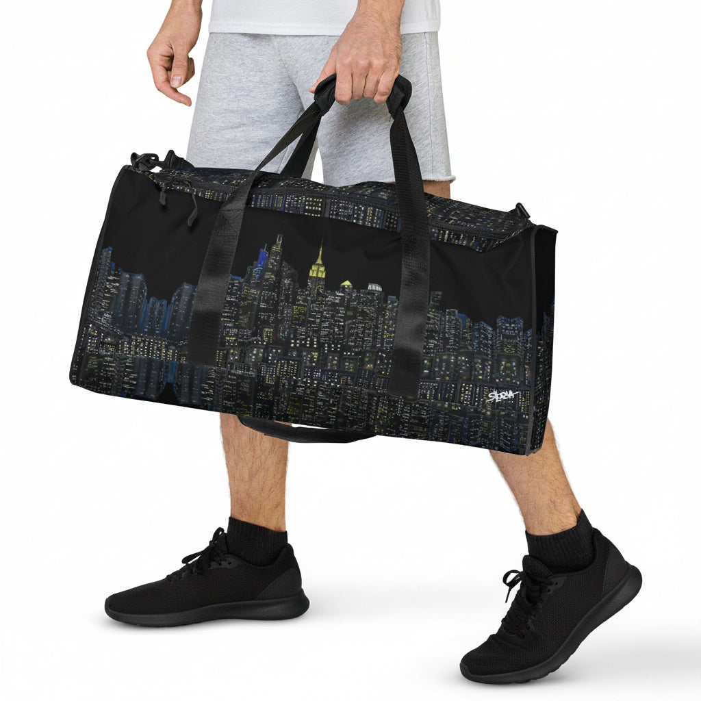 Black duffel bag with NY cityscape designed by Loria NYC Art on a white background