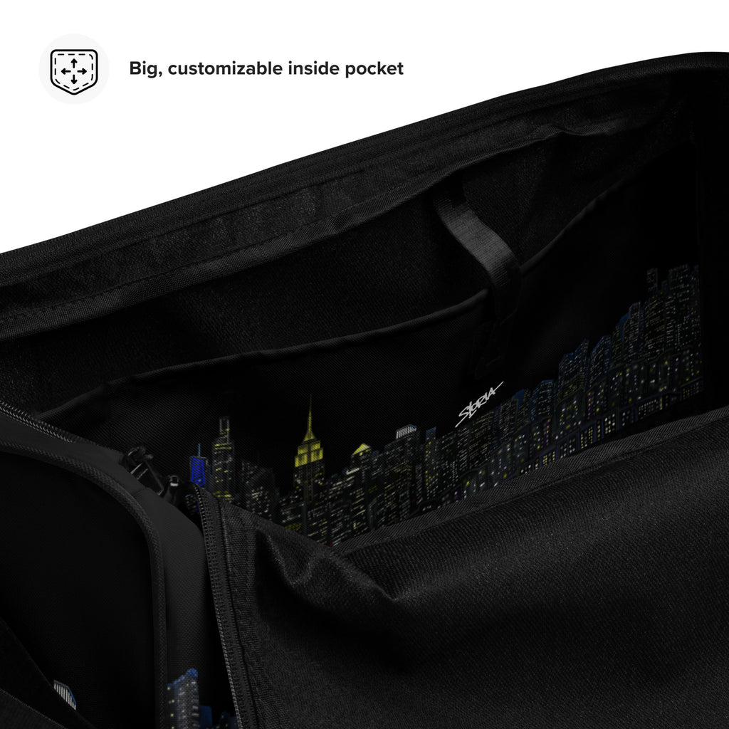 Black Loria NYC Art bag with a cityscape design on the inside pocket, featuring text 'Big, customizable inside pocket'.