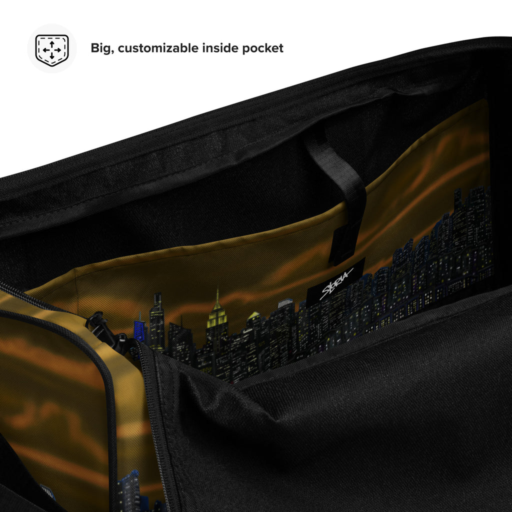 Brown Duffle bag with NY cityscape design by Loria NYC Art  on a white background Black bag with side pocket featuring a cityscape design.