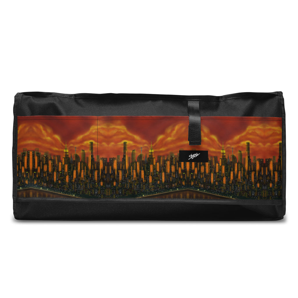 Black duffel bag with a cityscape design on a white background