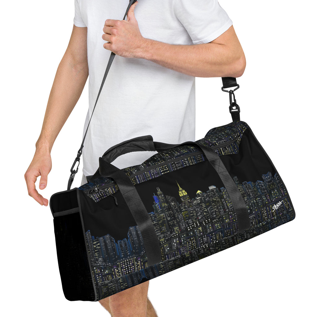 Black duffel bag with NY cityscape designed by Loria NYC Art on a white background