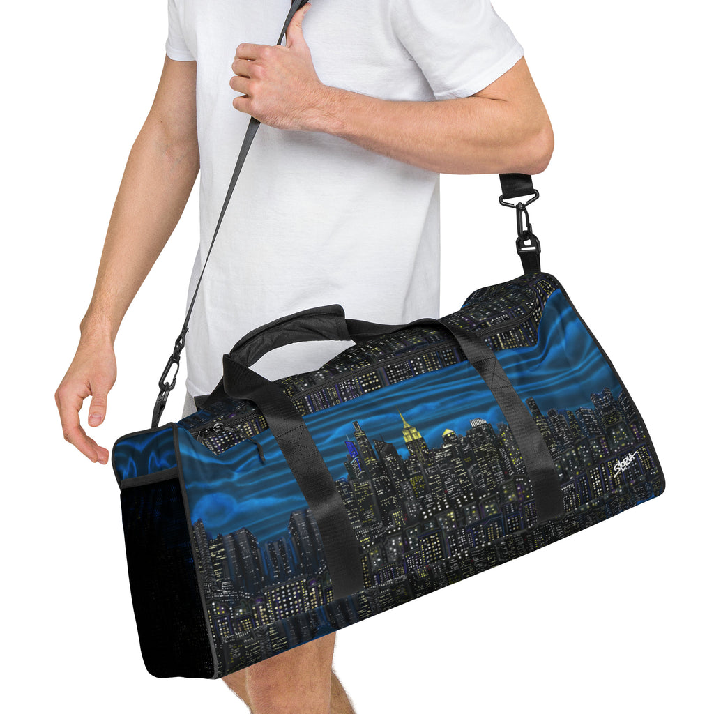 Man carrying a Loria NYC Art designed duffle bag on  white background 