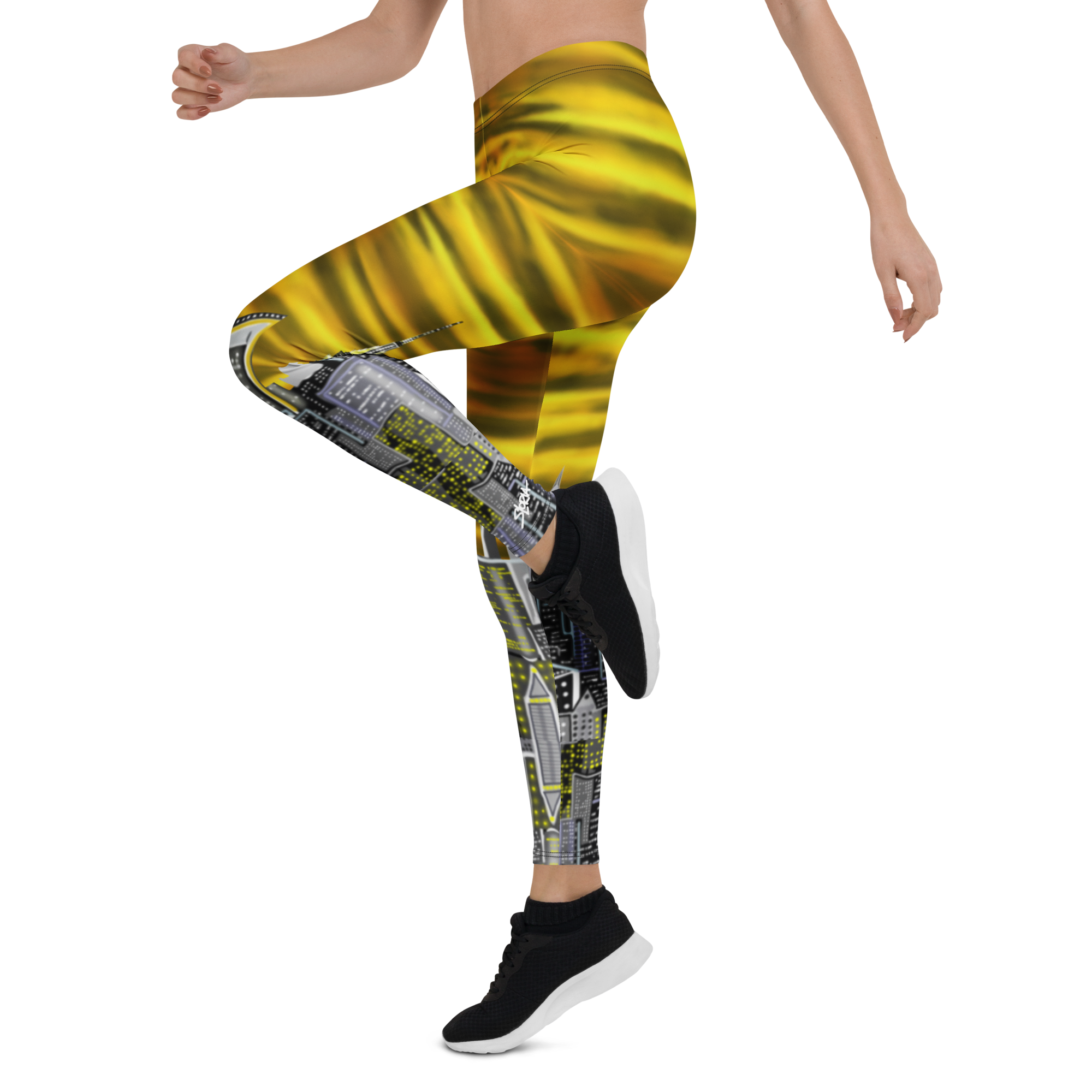 Person wearing yellow and gray patterned Loria NYC Art leggings on a white background