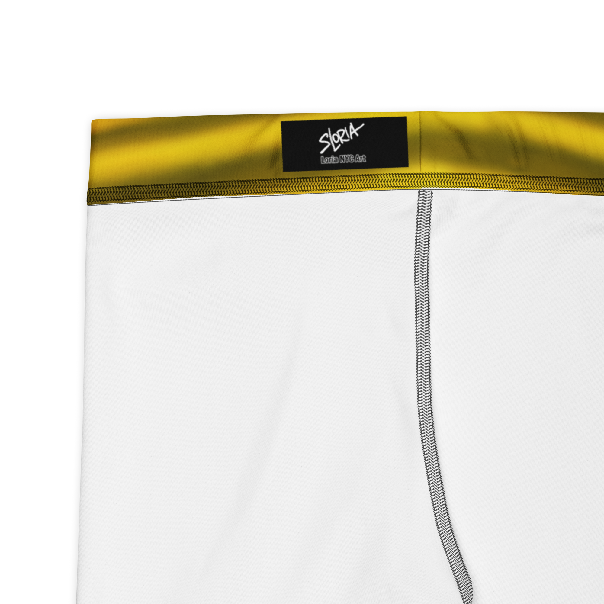 White athletic shorts with a yellow waistband and black brand Loria NYC Art label on a white background